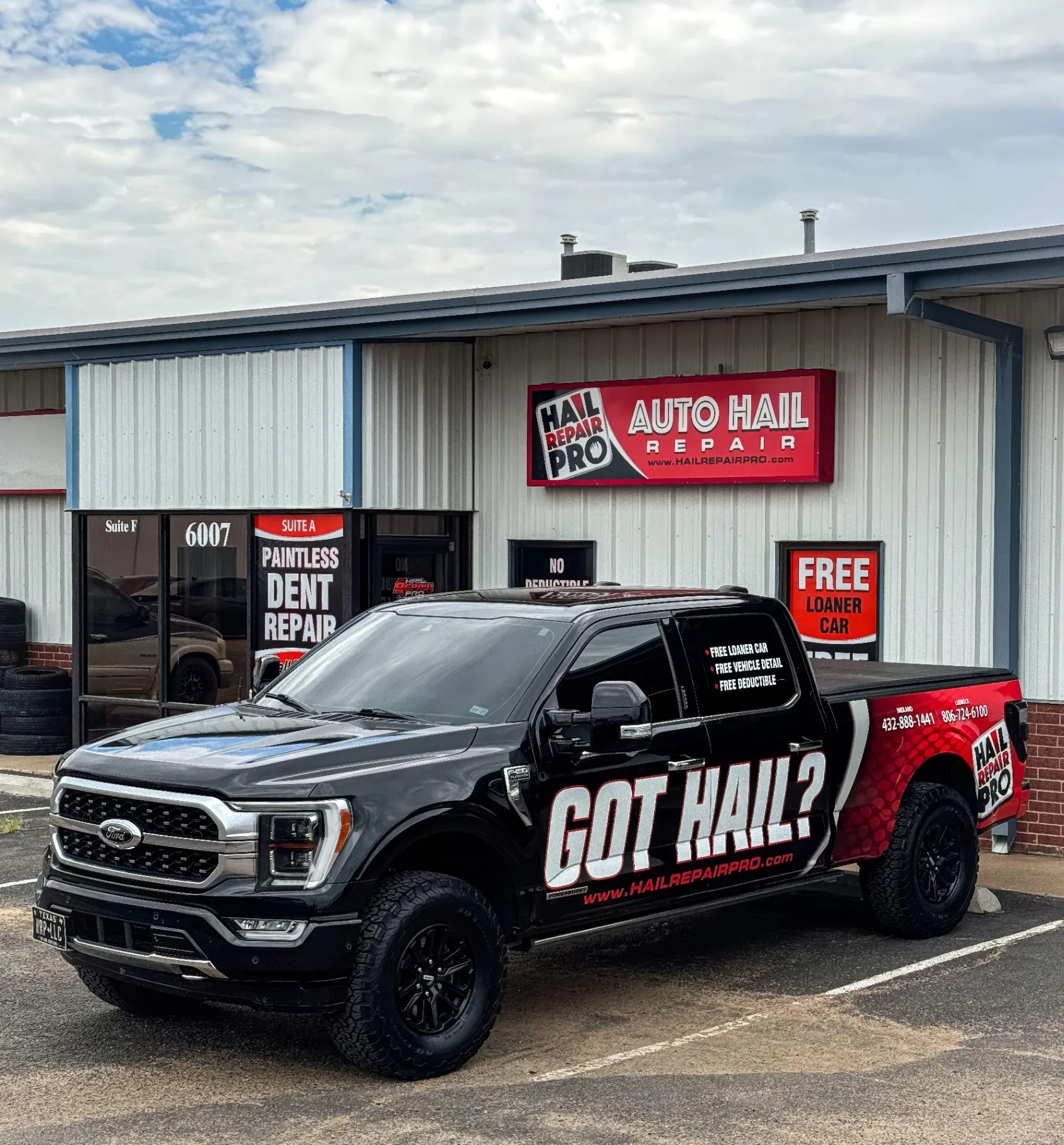 Hail Repair Pro Lubbock TX — Got Hail? Free Loaner Car, Free Vehicle Detail, Deductible Covered up to $1,000 | 6007 43rd St Ste A | (806) 724-6100 Hail Repair Pro 'Got Hail?' wrapped Ford F-150 parked outside the Lubbock, TX auto hail repair shop at 6007 43rd St Ste A — Paintless Dent Repair signage advertising Free Loaner Car, Free Vehicle Detail and Deductible Covered up to $1,000; call (806) 724-6100